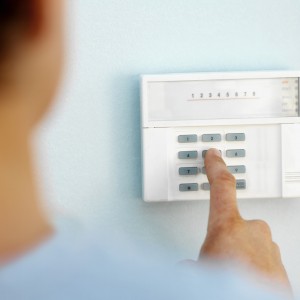 Man putting in alarm code